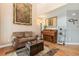 Cozy living room featuring hardwood floors, comfortable seating, and a decorative area rug at 4217 S Jericho St, Aurora, CO 80013