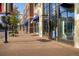 Charming street view with well-maintained sidewalks, retail stores, and hanging flower baskets in a walkable neighborhood at 4217 S Jericho St, Aurora, CO 80013