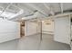 Spacious unfinished basement with concrete flooring, exposed ductwork, and freshly painted walls at 4353 Sherman St, Denver, CO 80216
