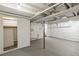 Unfinished basement with painted walls, concrete flooring, and exposed ceiling beams at 4353 Sherman St, Denver, CO 80216