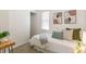 Sunlit bedroom with neutral tones, a closet, minimalist decor, and a comfortable atmosphere at 4353 Sherman St, Denver, CO 80216