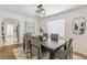 Bright dining room with natural light, stylish decor, and archway view into kitchen at 4353 Sherman St, Denver, CO 80216