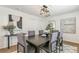 Bright dining room featuring modern light fixture, decor, and seating for six at 4353 Sherman St, Denver, CO 80216