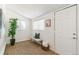 Bright entryway featuring hardwood floors, bench seating, and natural light at 4353 Sherman St, Denver, CO 80216
