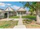 Well-maintained home with a welcoming front porch and beautiful landscaping, enhancing curb appeal at 4353 Sherman St, Denver, CO 80216