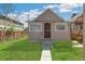Quaint home exterior with a landscaped lawn, inviting entryway, and classic architectural details at 4353 Sherman St, Denver, CO 80216