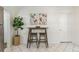 Kitchen featuring a breakfast bar, botanical art, and tile flooring at 4353 Sherman St, Denver, CO 80216