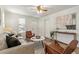 Cozy living space featuring contemporary decor, a comfortable couch, and natural light at 4353 Sherman St, Denver, CO 80216
