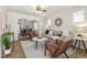 Bright living room with modern decor, including a plush sofa and stylish accent chairs at 4353 Sherman St, Denver, CO 80216
