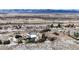 An aerial view of a house on a large lot with mountain views at 7338 W Lakeside Dr, Littleton, CO 80125