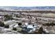 Aerial view of the home in a rural setting, surrounded by trees and snow-covered fields at 7338 W Lakeside Dr, Littleton, CO 80125