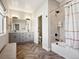 Bright bathroom with double vanity, modern fixtures, and separate tub/shower combo at 397 East St, Louisville, CO 80027