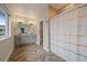 Well-lit bathroom with double vanity, modern fixtures, and separate tub/shower combo with stylish tile at 397 East St, Louisville, CO 80027