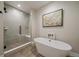 Contemporary bathroom with a freestanding tub, glass shower, and stylish tile accents at 397 East St, Louisville, CO 80027