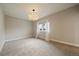 Minimalist bedroom featuring modern lighting, neutral walls, and a large window at 397 East St, Louisville, CO 80027