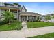 Charming gray home with a well-manicured lawn and inviting porch at 397 East St, Louisville, CO 80027