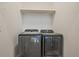 Modern laundry room equipped with sleek, front-load washer and dryer units at 397 East St, Louisville, CO 80027