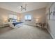 Spacious main bedroom with plush carpet, a modern light fixture, and large window with scenic views at 397 East St, Louisville, CO 80027
