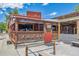 A vibrant restaurant featuring an inviting outdoor patio and rustic wooden architecture at 397 East St, Louisville, CO 80027