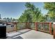 Deck features wood railings and plenty of space for outdoor furniture at 4833 S Pitkin Ct, Aurora, CO 80015