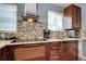 Modern kitchen showcasing sleek countertops, updated appliances, and a stylish tile backsplash at 4833 S Pitkin Ct, Aurora, CO 80015