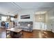 Spacious living room with an open layout, hardwood floors, and staircase access at 4833 S Pitkin Ct, Aurora, CO 80015