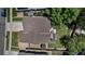 Aerial view of the property featuring a well-maintained roof, large yard, and patio at 16352 E 104Th Way, Commerce City, CO 80022
