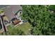 Overhead backyard shot revealing a deck, garden, and mature trees providing shade and beauty at 16352 E 104Th Way, Commerce City, CO 80022