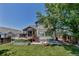 Backyard view featuring a deck, garden, and fire pit, providing a serene outdoor retreat at 16352 E 104Th Way, Commerce City, CO 80022