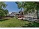 Charming backyard with a patio, garden, fire pit, and deck with stairs, ideal for relaxing and gardening at 16352 E 104Th Way, Commerce City, CO 80022