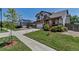 Lovely two-story home with a well-kept lawn and inviting front porch in a residential neighborhood at 16352 E 104Th Way, Commerce City, CO 80022