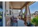 Cozy front porch featuring comfortable seating and decorative plants, creating a welcoming entrance at 16352 E 104Th Way, Commerce City, CO 80022