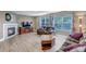 Cozy living room with fireplace, wood floors, and comfortable seating arrangement at 16352 E 104Th Way, Commerce City, CO 80022