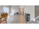 Bright, open-concept living space featuring wood flooring, neutral decor, and ample natural light at 16352 E 104Th Way, Commerce City, CO 80022