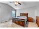 Main bedroom featuring vaulted ceiling, ceiling fan, and dark wood furniture at 16352 E 104Th Way, Commerce City, CO 80022