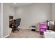 Home office featuring neutral walls, carpet flooring, and ample desk and storage space at 16352 E 104Th Way, Commerce City, CO 80022