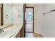 Bathroom connected to a bedroom, featuring a vanity and a mirror at 7476 E Arkansas Ave # 35-10, Denver, CO 80231