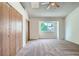 Large, bright bedroom with neutral carpet, closet space and a window at 7476 E Arkansas Ave # 35-10, Denver, CO 80231