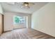 Carpeted bedroom with a large window and ample space at 7476 E Arkansas Ave # 35-10, Denver, CO 80231