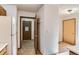 Bright hallway view leading to the kitchen and front door at 7476 E Arkansas Ave # 35-10, Denver, CO 80231
