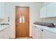 Laundry room featuring a washing machine and dryer at 7476 E Arkansas Ave # 35-10, Denver, CO 80231