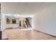 Bright open concept living room featuring hardwood floors, a fireplace, and staircase to the second floor at 7476 E Arkansas Ave # 35-10, Denver, CO 80231