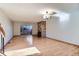 Spacious living room with wood floors, brick fireplace, sliding glass doors leading to a patio at 7476 E Arkansas Ave # 35-10, Denver, CO 80231