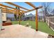 Inviting backyard with a pergola, fire pit, and lush green lawn perfect for entertaining at 19820 E Amherst Dr, Aurora, CO 80013