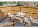 Cozy back deck featuring comfortable seating and a privacy fence, perfect for outdoor relaxation at 6054 S Akron Way, Greenwood Village, CO 80111