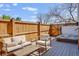 Back deck with outdoor furniture and a hot tub, perfect for relaxing and entertaining at 6054 S Akron Way, Greenwood Village, CO 80111