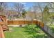 Private backyard with a well-maintained lawn and tall fence, perfect for outdoor enjoyment at 6054 S Akron Way, Greenwood Village, CO 80111