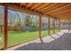 Under the deck is a shady place to relax and still enjoy the beautiful, well-maintained lawn at 6054 S Akron Way, Greenwood Village, CO 80111