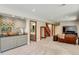 Finished basement with wet bar, bathroom, stairs, and entertainment area with a TV at 6054 S Akron Way, Greenwood Village, CO 80111