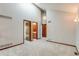 Spacious bedroom with high ceilings, wood trim, and multiple doorways leading to other areas of the house at 6054 S Akron Way, Greenwood Village, CO 80111